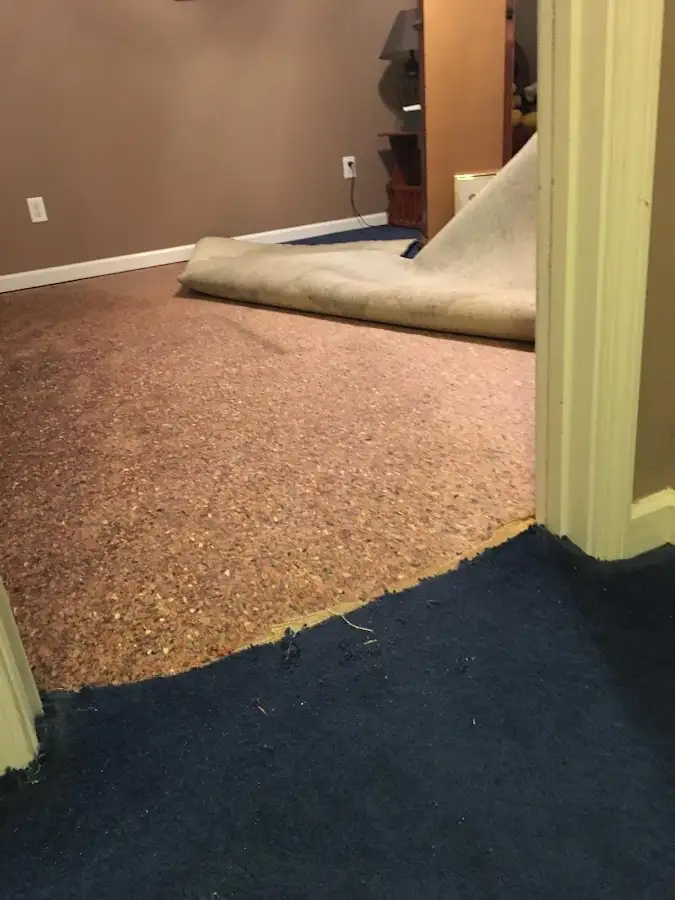 Carpet pad removal revealing water damage during Drying & Dehumidification in Kahului